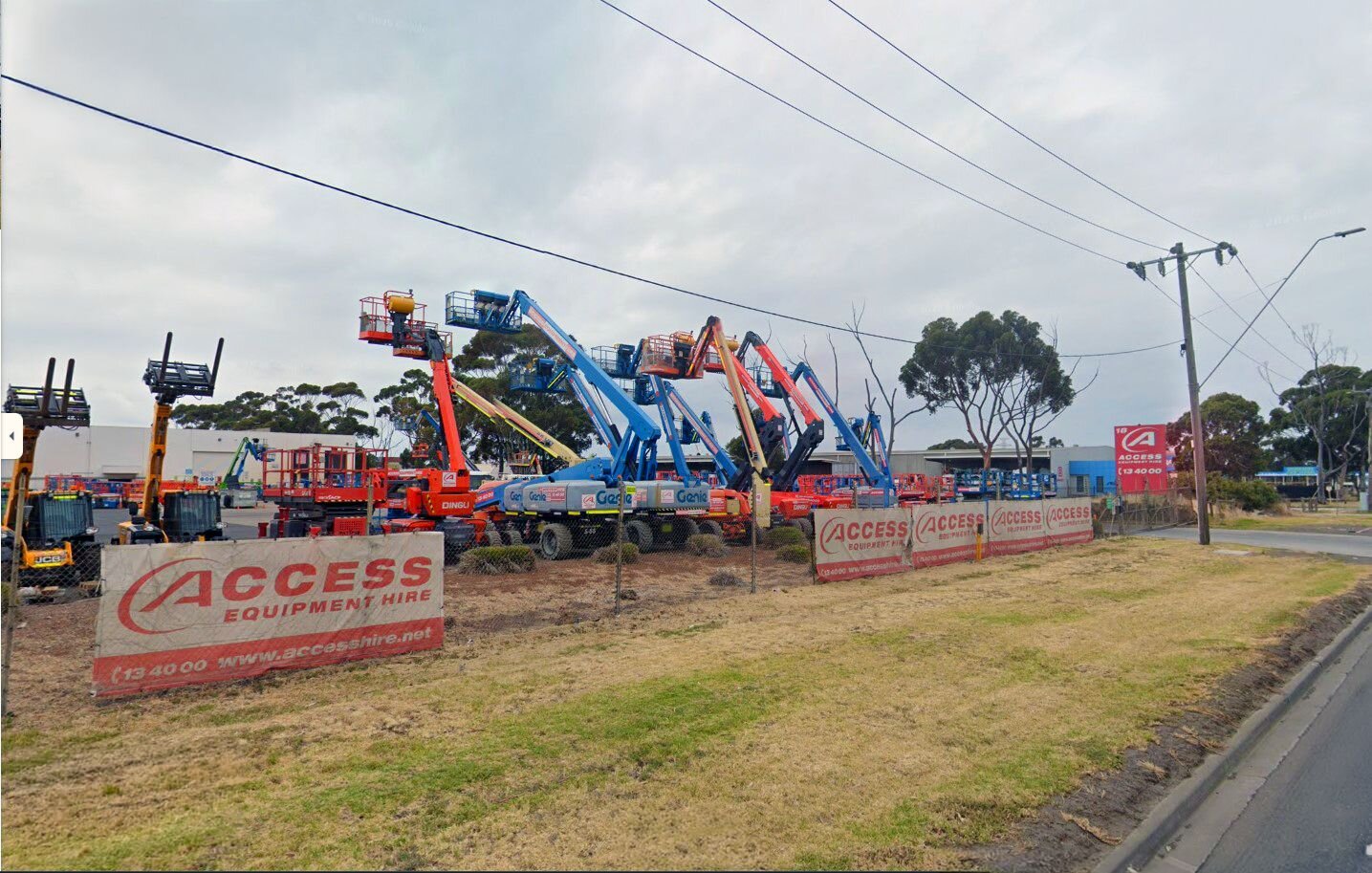 Access Hire Melbourne branch with boom lifts, telehandlers and access equipment displayed in the yard.
