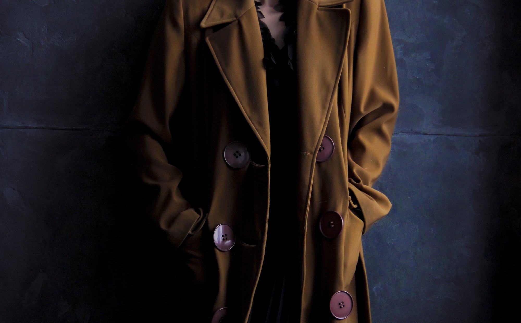 Person wearing a brown coat