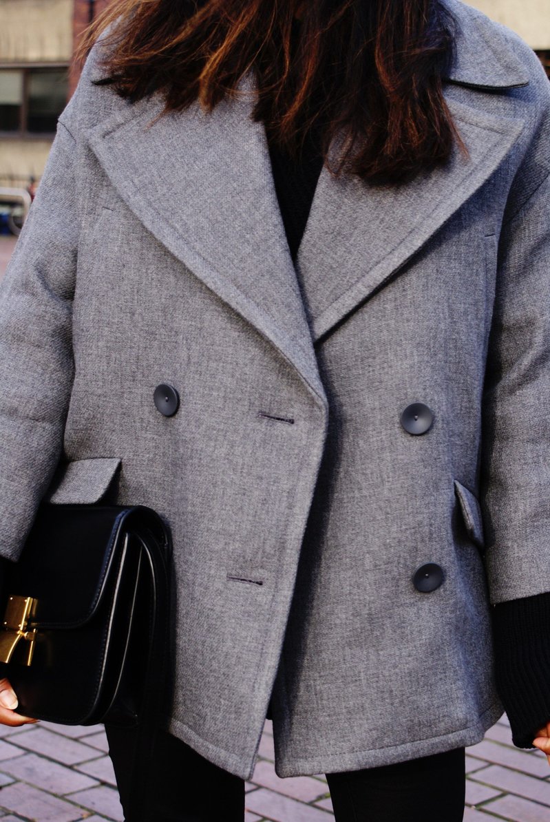 Close up of Sachini wearing a grey coat