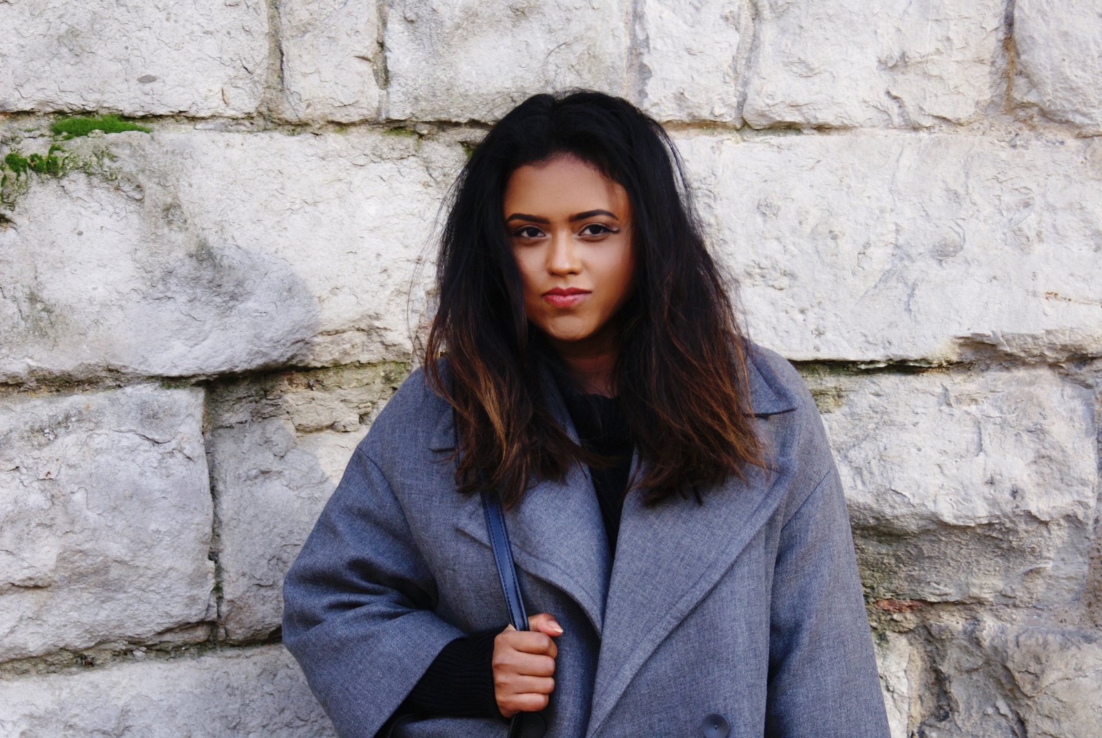 Sachini wearing a grey coat