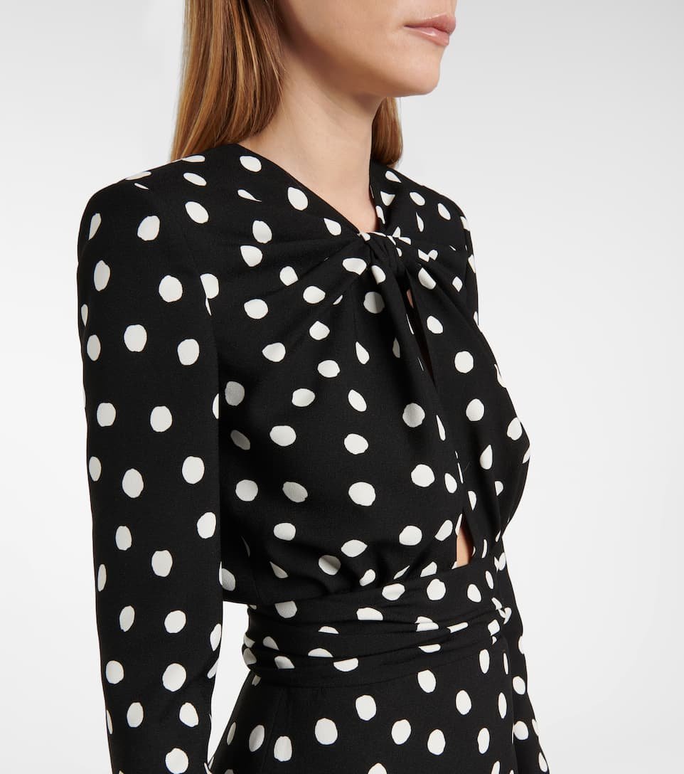 Model wearing a black and white Reformation polkadot