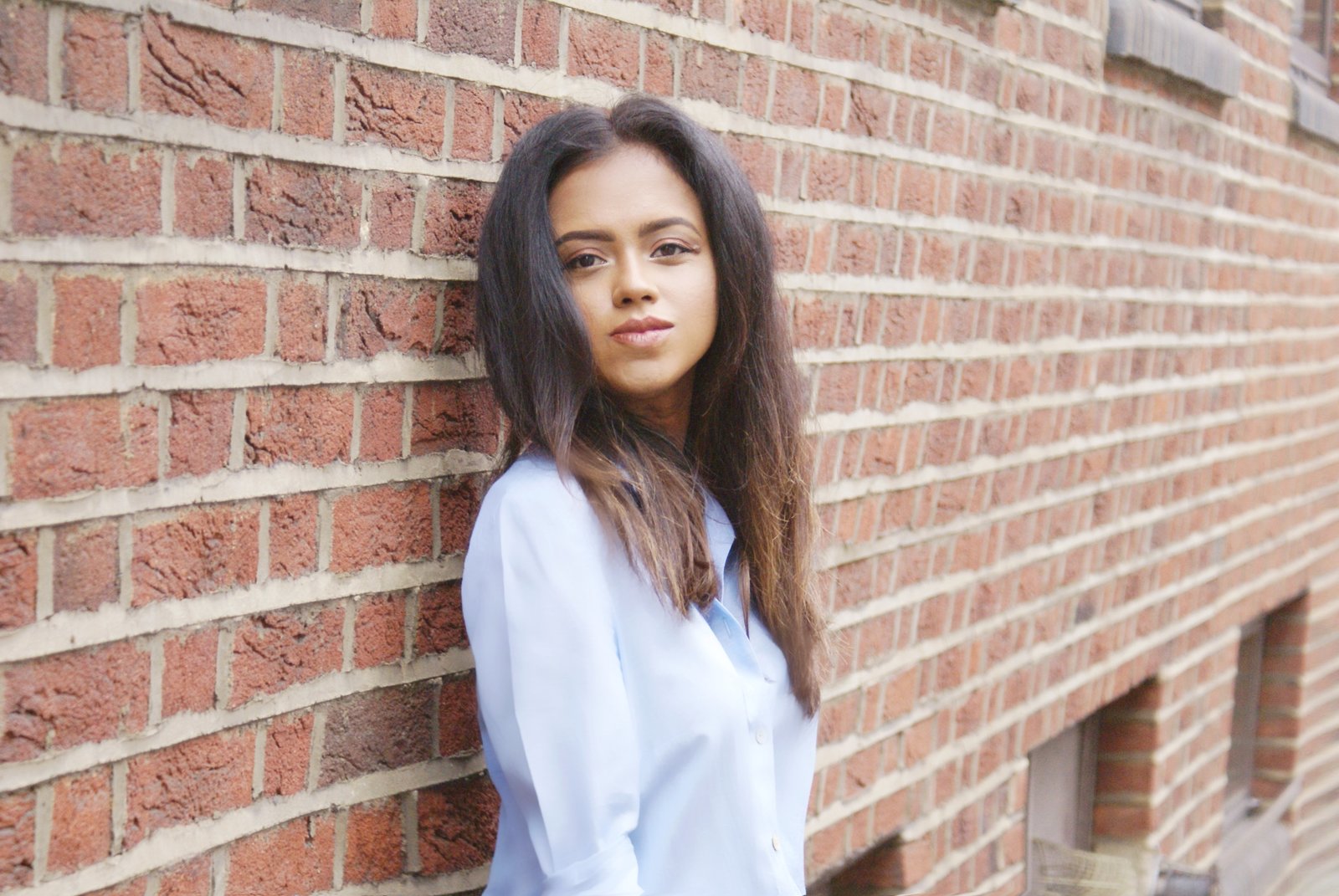 Close up of Sachini wearing a blue top