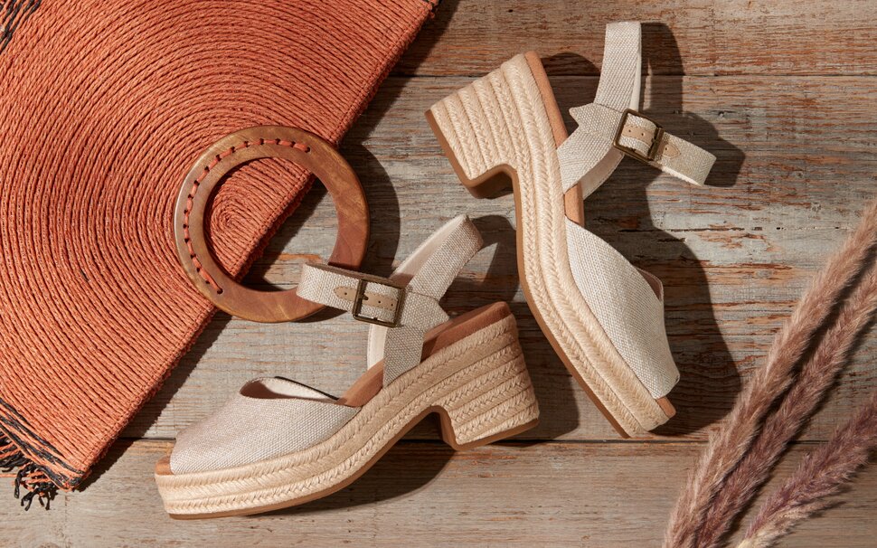 Model wearing Sloane Strappy Sandal in leather tan shown.