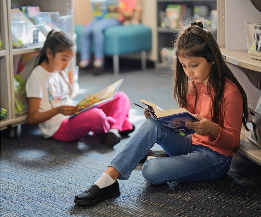 Children reading in a library.