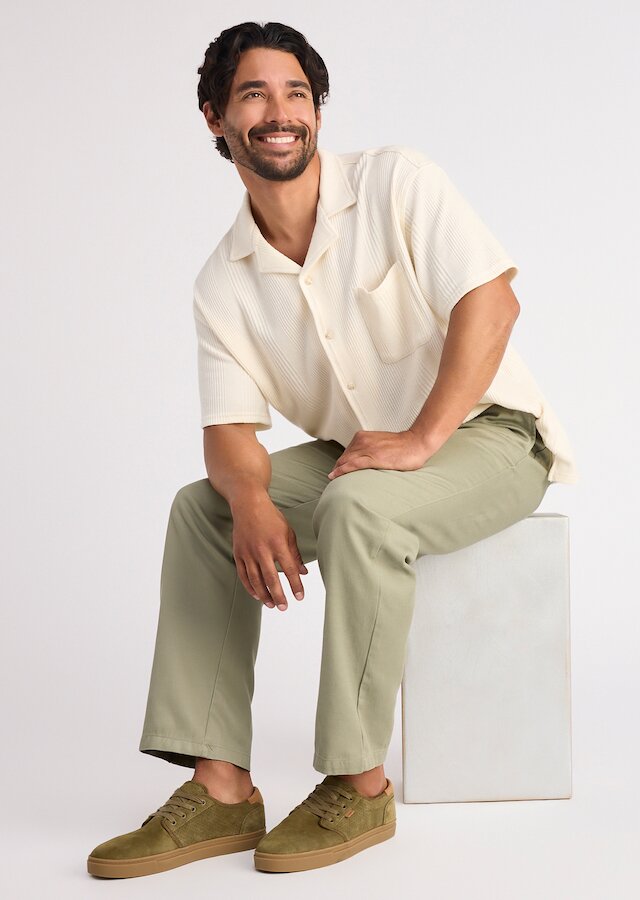 Model wearing Carlo 2.0 Lace-Up Sneaker in military olive perforated suede shown.