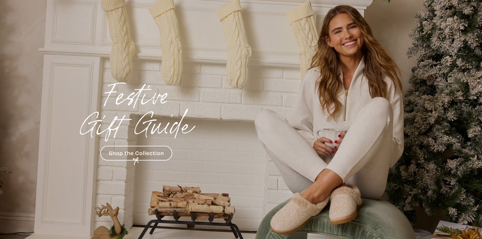 Festive Gift Guide. Shop the Collection Model sitting on chair in Oslo slipper.