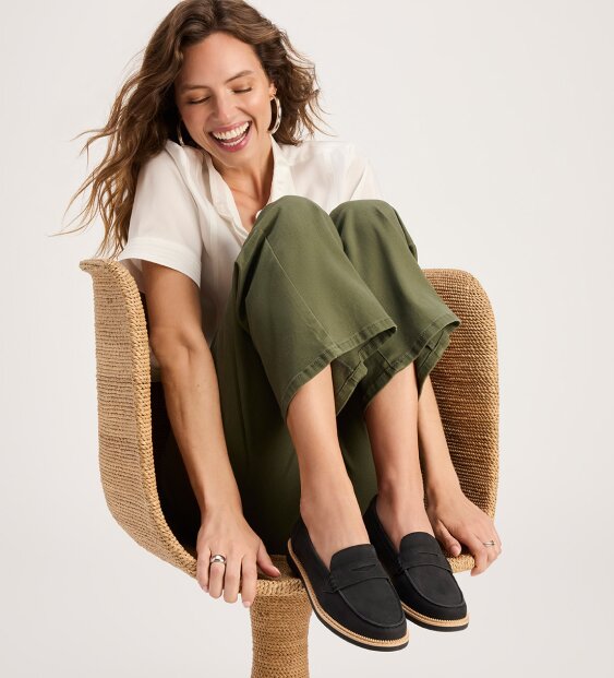 Model wearing Marie Loafer in Black Leather.