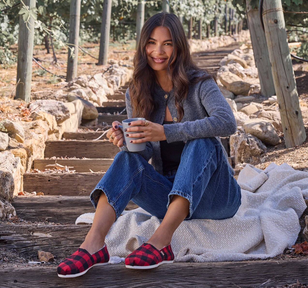 Model wearing Alpargata Classic in buffalo plaid red faux shearling shown.