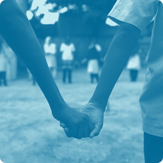 Two people holding hands.