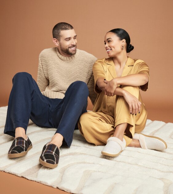 Women's Oslo and men's Camden Slippers in various colors shown.