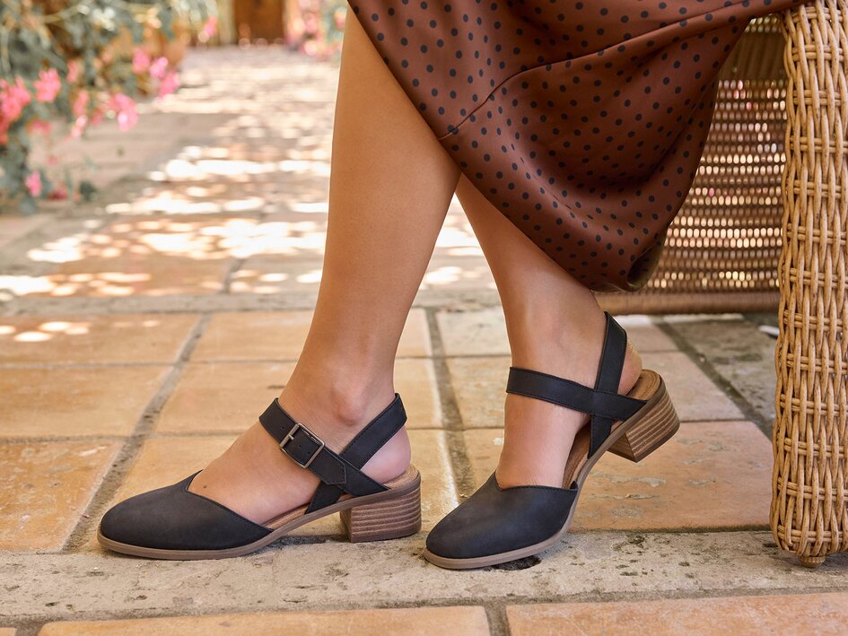 Closeup of Jaclyn block heel paired with a skirt.
