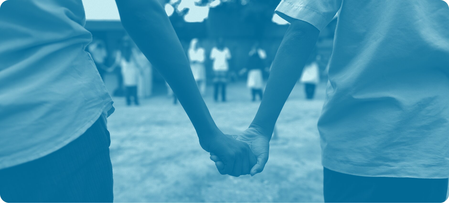 Two people holding hands.