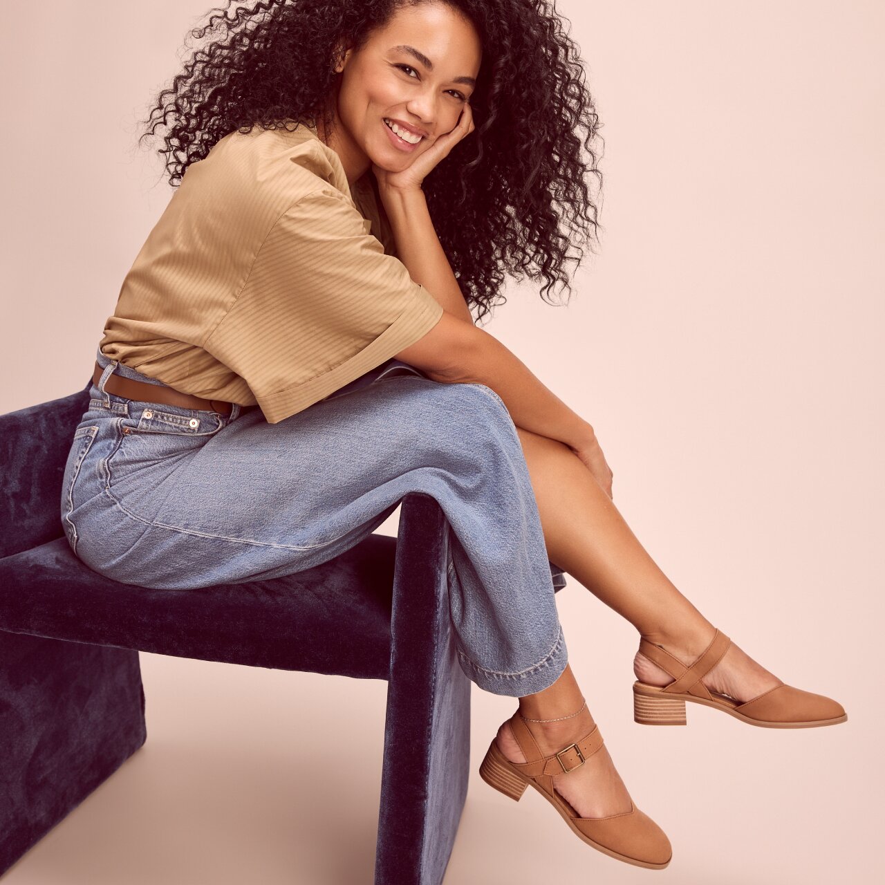 Model wearing Jaclyn Heel in brown leather shown.