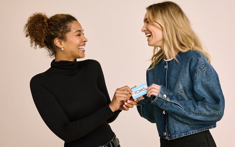 Giving a TOMS gift cards.