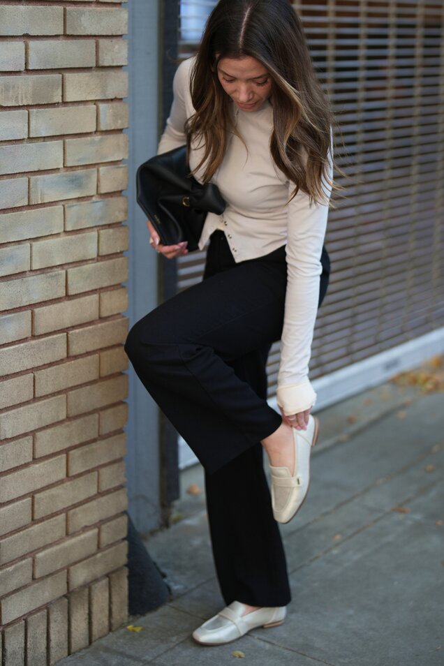 Model wearing women's Lynette Loafer in champagne metallic suede shown.