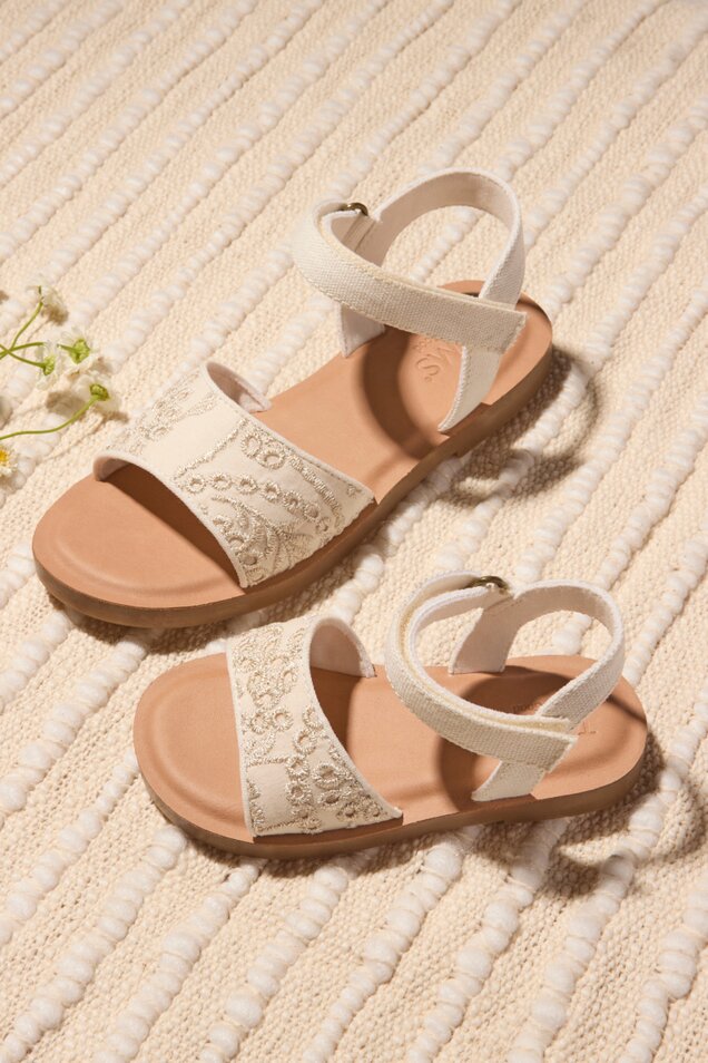 A sweet new sandal for your toddler The Remi is comfy thanks to CloudBound™ insoles and easy for them to put on and play in with a secure hook and loop ankle strap. Finished with elegant botanical eyelet details, these are the perfect special occasion pair