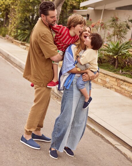 Rocky Barnes and family wearing TOMS footwear shown.