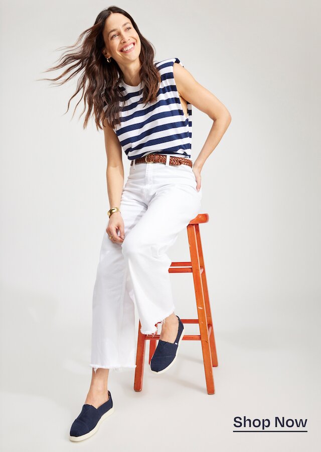 Model wearing women's Alpargata Plus in navy heritage canvas shown. Shop Now.