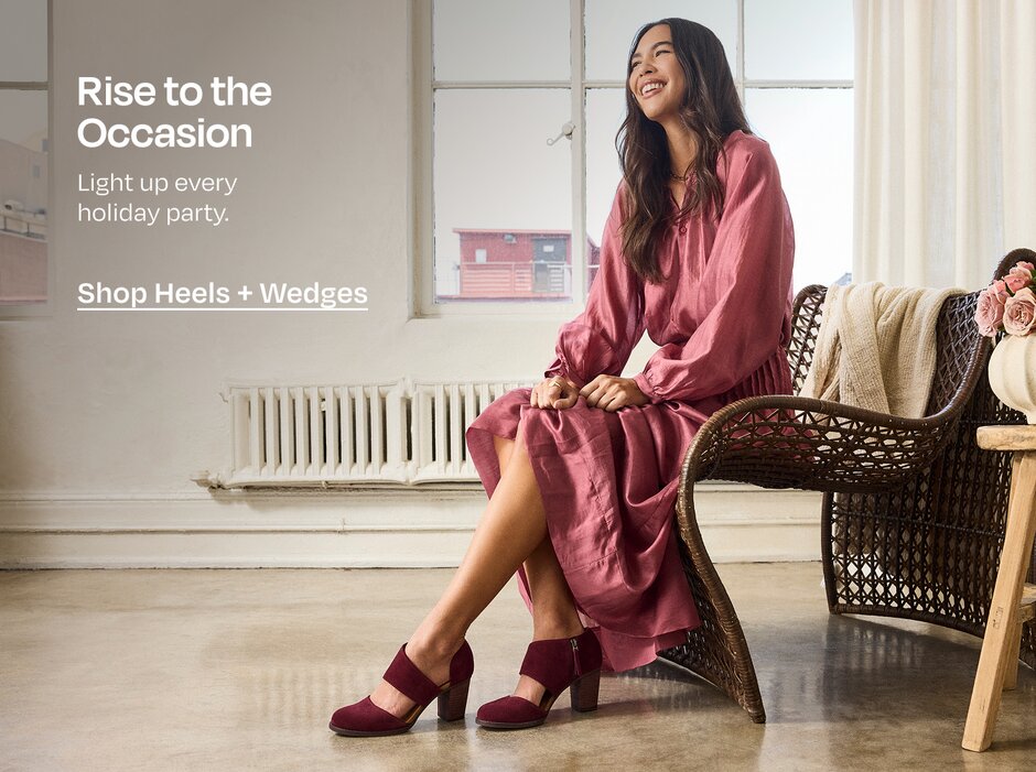 Rise to the Occasion. Light up every holiday party. Shop Heels + Wedges. Model in burgundy heels and long dress.