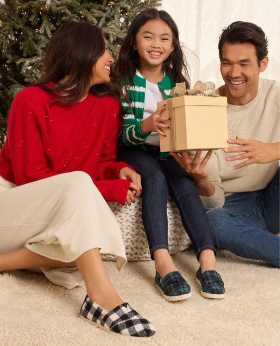 A family wearing TOMS footwear shown.
