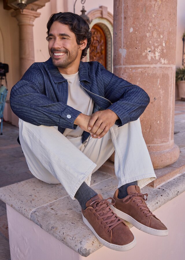 Model wearing TRVL LITE Lace-Up Sneaker in tan leather shown.