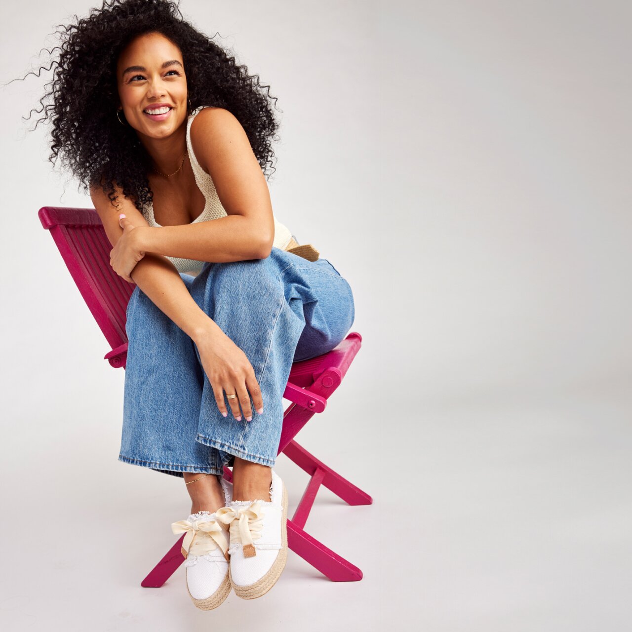 Model wearing Women's Carolina Lace-Up Espadrille in white beachside woven shown.