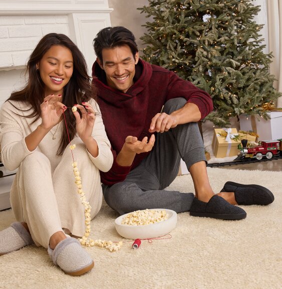 Models wearing TOMS slippers shown.