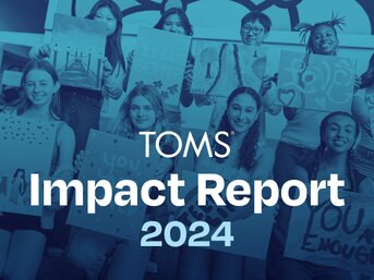 A group of kids holding paintings. TOMS Impact Report 2024.