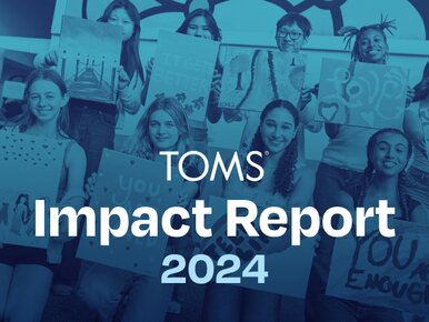 A group of kids holding paintings. TOMS Impact Report 2024.