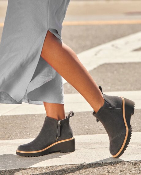 Model wearing Maude Wedge Boot Forged Iron Suede.