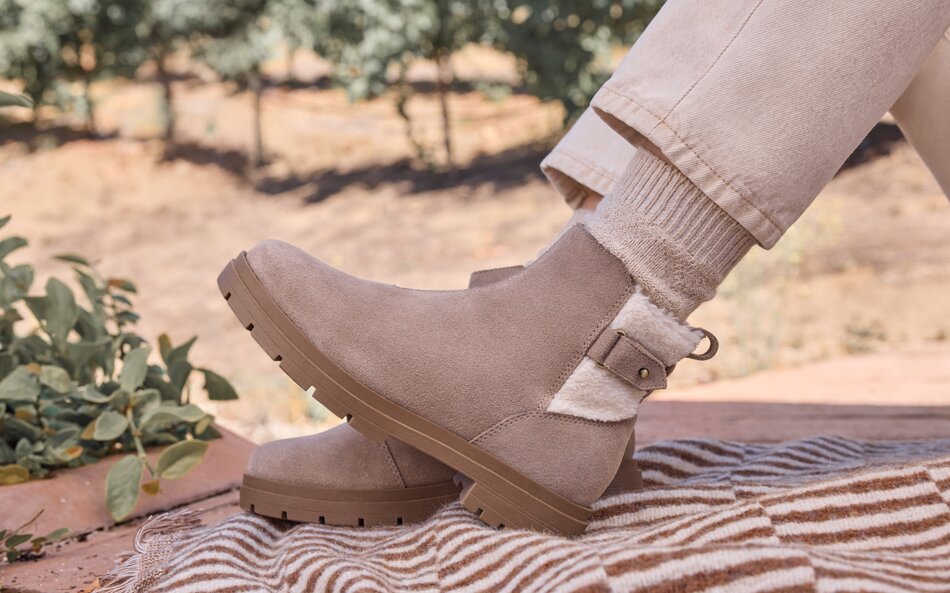 Model wearing Astrid Boot Water Repellent Dune Suede.