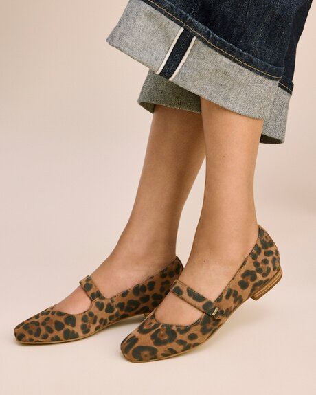 Model wearing Bianca Flat in brown sugar leopard print suede shown.