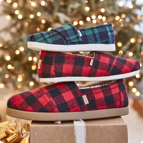 Closeup of Alpargata Classic in Buffalo Plaid Red Faux Shearling and Kids shoe in Navy Plaid.
