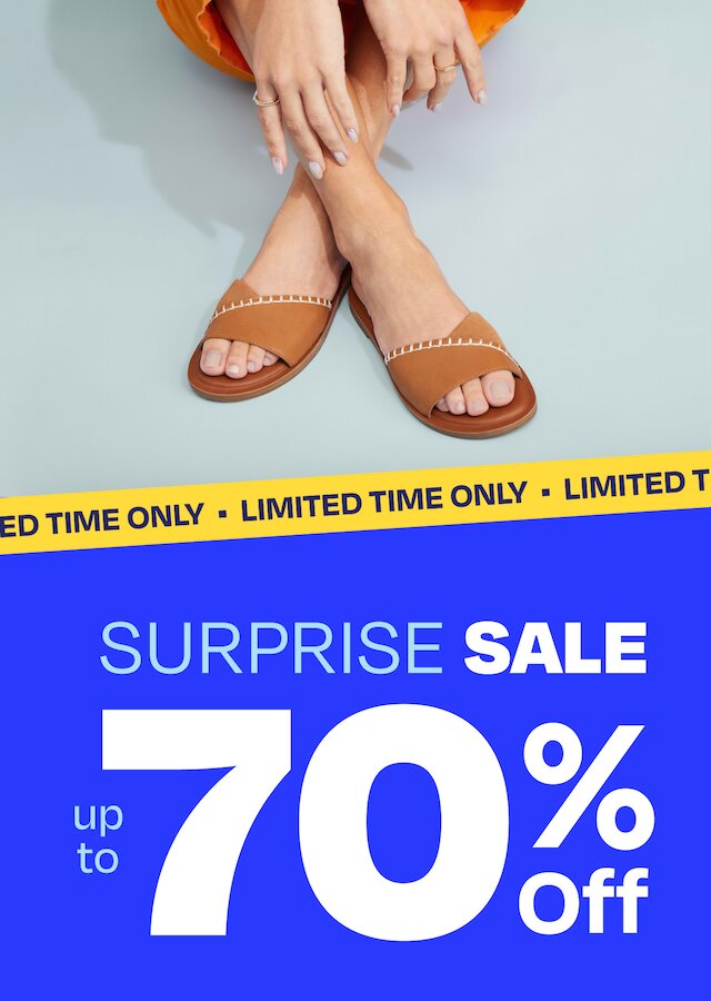 Limited Time Only tape. Surprise Sale. Up to 70% Off. Model wearing Shea Slide Sandal in tan leather shown.