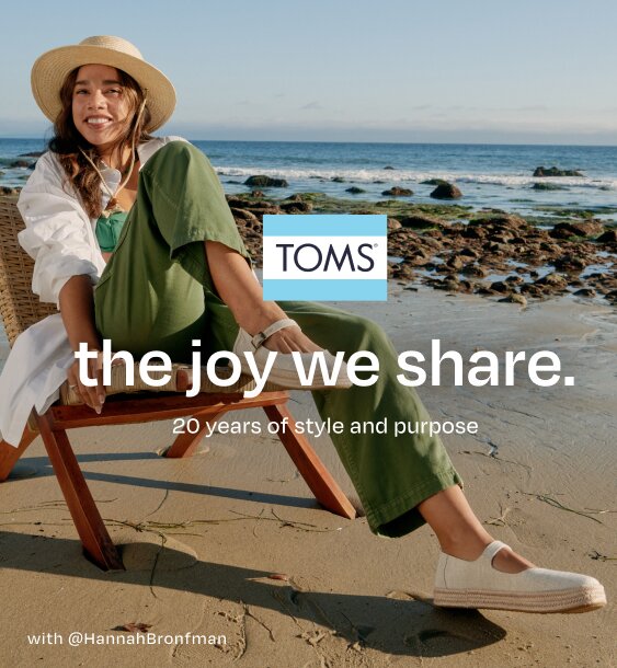 TOMS logo. the joy we share. 20 years of style and purpose. Caption: @HannahBronfman. Hannah sitting. Beach background.