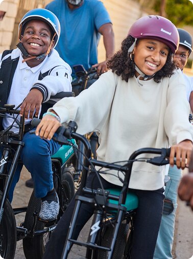 Kids from the East Side Riders Bike Club riding bikes.