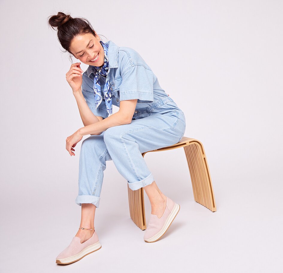 Model wearing women's TOMS footwear shown.