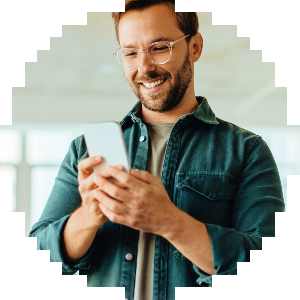 Man using a phone indoors beside a Mimo Certificate of Completion for HTML.