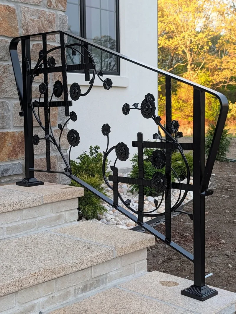 Ornamental black iron railing with floral details