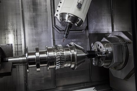 5th axis CNC machine with an end mill cutting complex tool paths