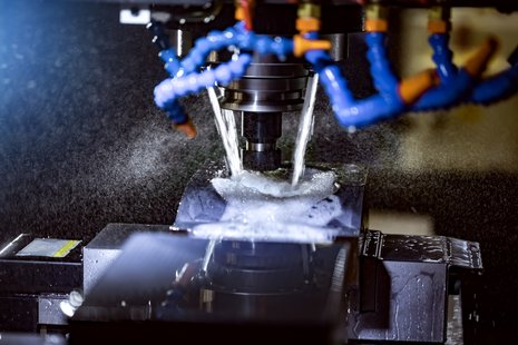 End Mill in action with coolant being used inside a CNC machine