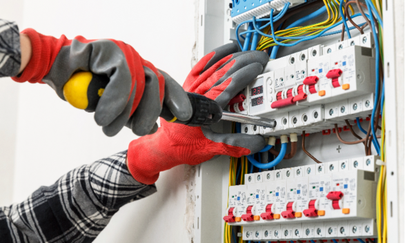 Electrician is fixing connector