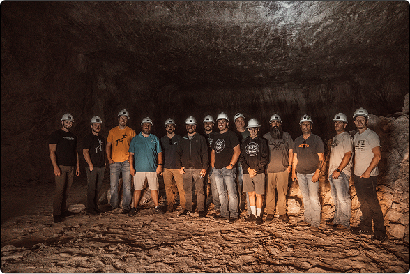 The Redmond Hunt team stand together in a tunnel inside the Redmond Salt Mine.