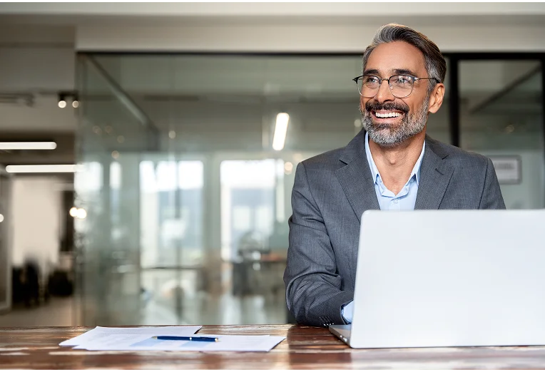 Professional working on a laptop in an office