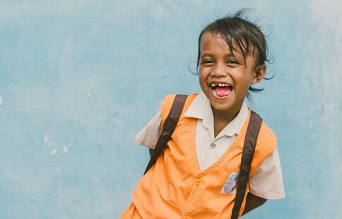 a happy child in her school uniform
