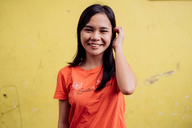 Joy smiling to camera