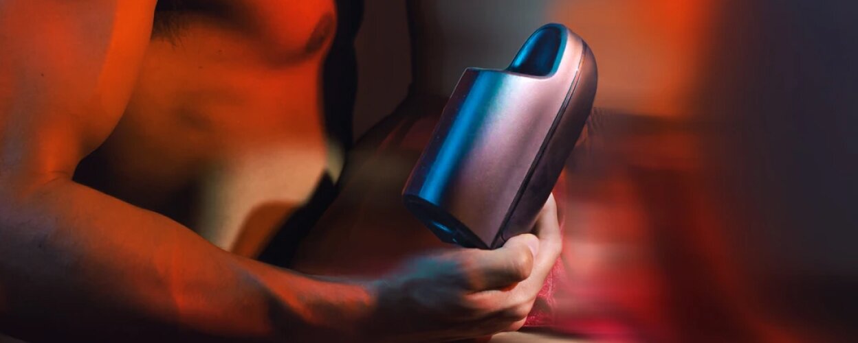 A man holding an arcwave toy in his hand