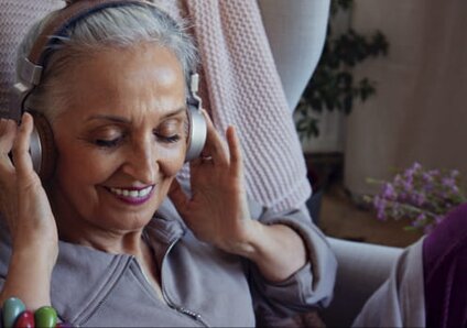 senior woman listening to music