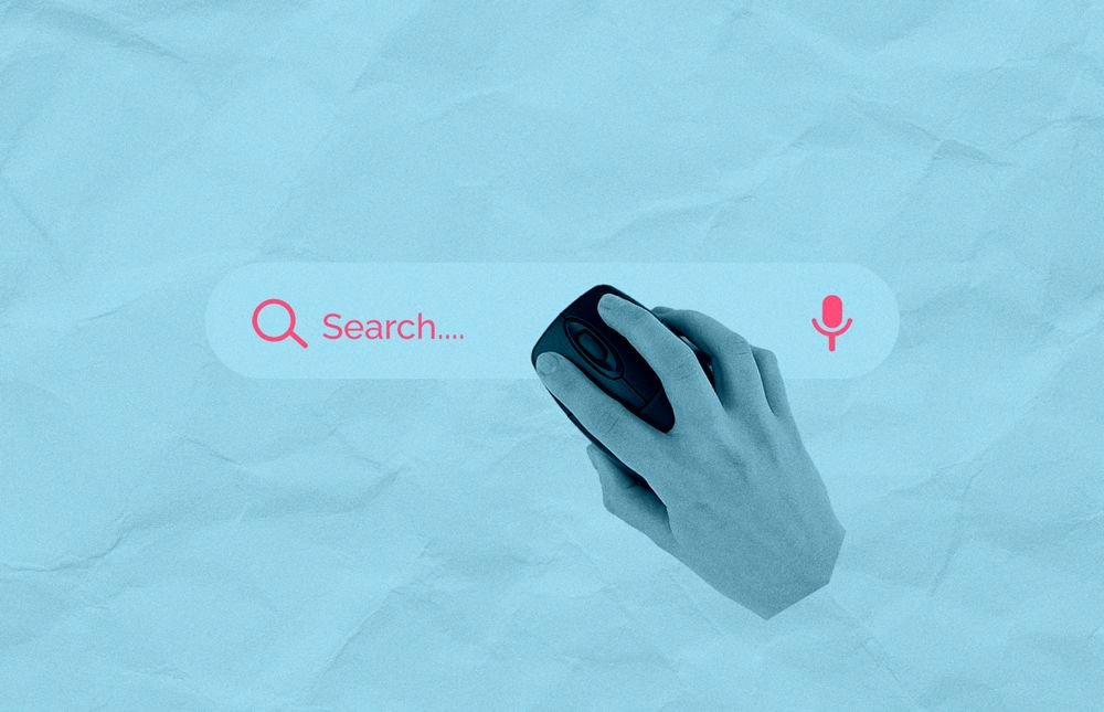 Black and white photo of a hand using a mouse hovering over a search bar.