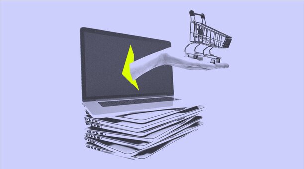 A laptop with a screen opened on a stack of other laptops. A hand is reaching out of the screen and holding a shopping cart.